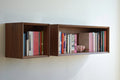 floating bookcase made of walnut veneer