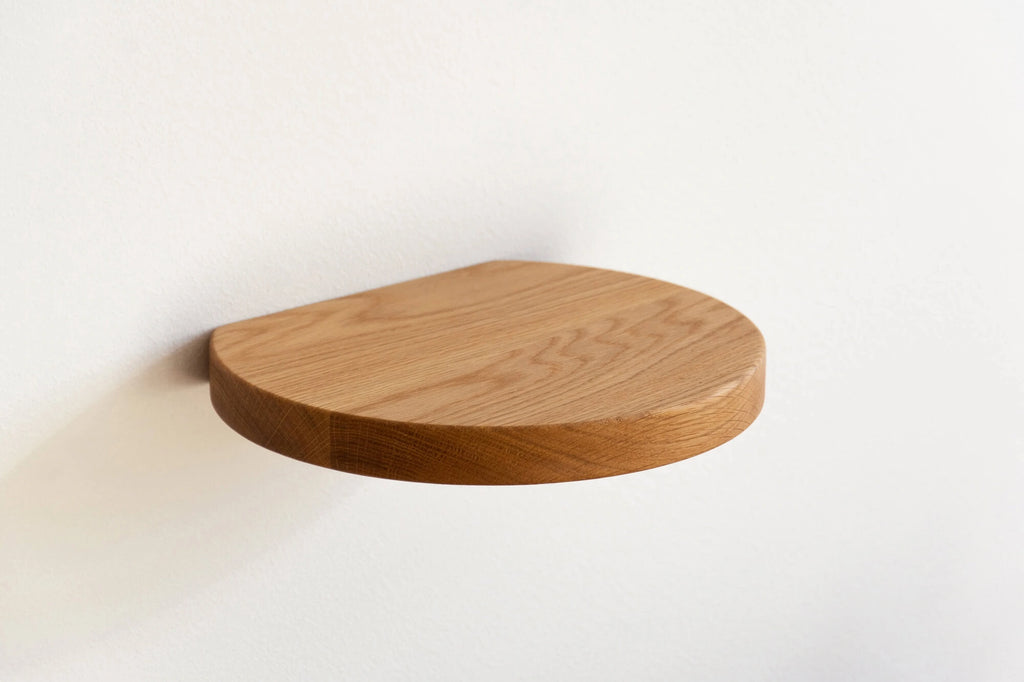 round floating shelf made of oak